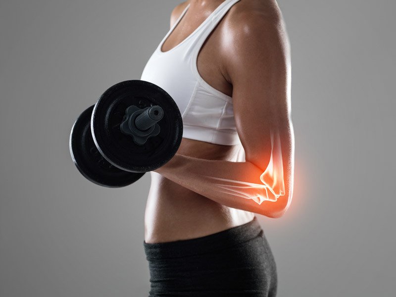 Life Extension, a woman in training outfit lifting weight with focus on the elbow joint, only torso is showing